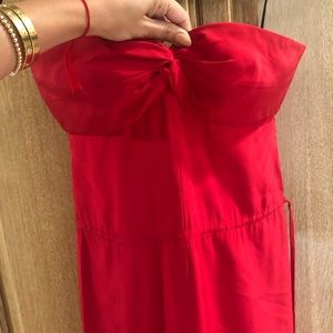 Red silk jumpsuit with side drawstring